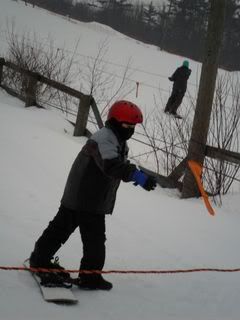 Sam snowboarding